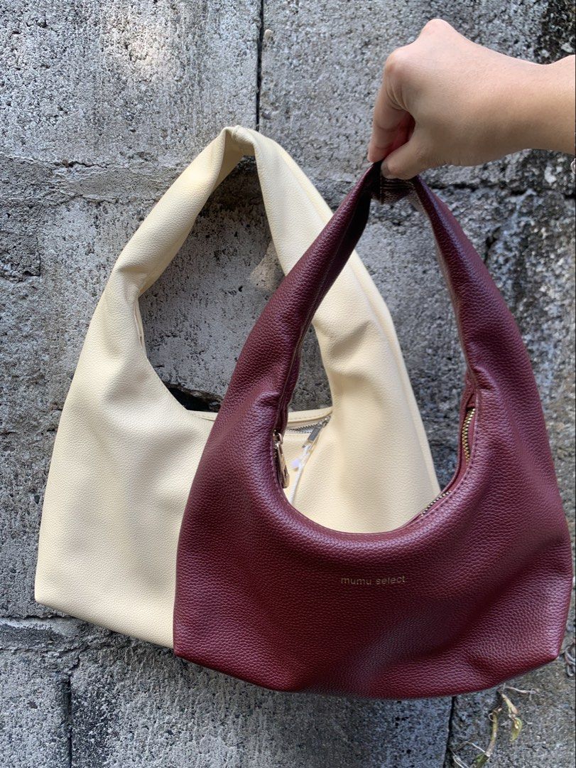 Hobo Bag (Category: Shoulder Bags) located in Bayombong. Submitted by declutterbyriri (Listing ID 1464651620, Image 1). Description: HOBO BAG SOLD AS SET 💛❤️ MICHI in butter yellow - medium size - still have tag on it MUMUSELECT in burgundy - small size - FREE.