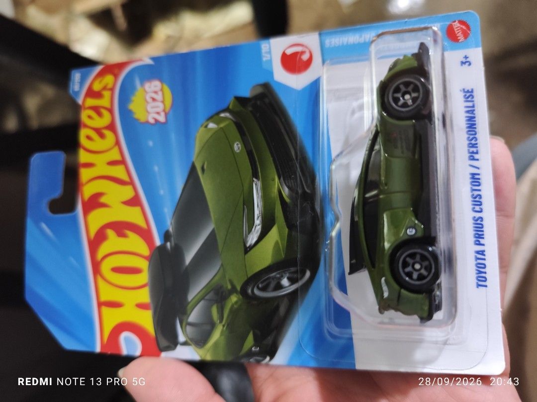 Hot Wheels Toyota Prius Custom Green (Category: Vehicle & Diecast Models) located in Las Pinas. Submitted by diazenstore (Listing ID 1464708341, Image 1). Description: - Brand: Mattel Hot Wheels - Model: Toyota Prius Custom (Olive Green) - Series: 1/10 release - Condition: Brand new, unopened blister pack on standard retail card - Ideal for die-cast collectors and modified car fans.