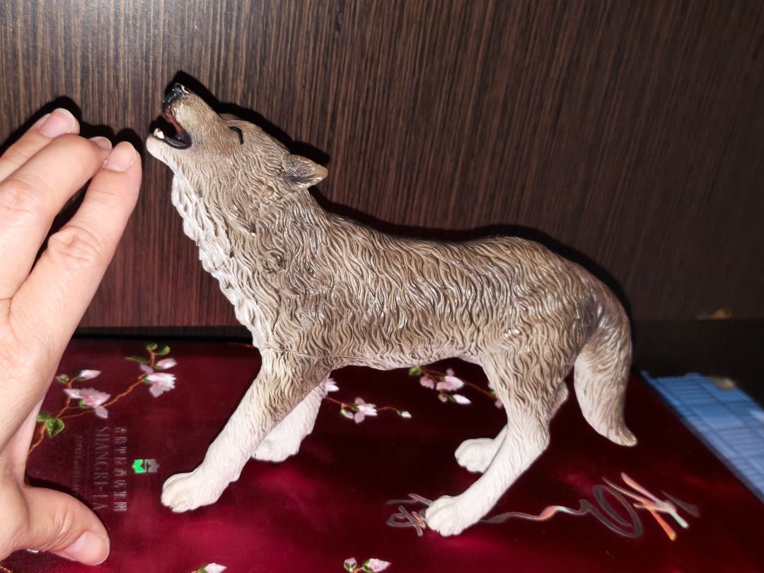 Howling Wolf Figurine Toy Animal Model (Category: Figurines & Statues) located in Manila. Submitted by olxph_674182959 (Listing ID 1464606871, Image 2). Description: - Realistic wolf figurine captured mid-howl - Highly detailed fur and expressive face - Perfect for collectors or as a decorative piece - Stands independently - A fun addition for animal lovers.