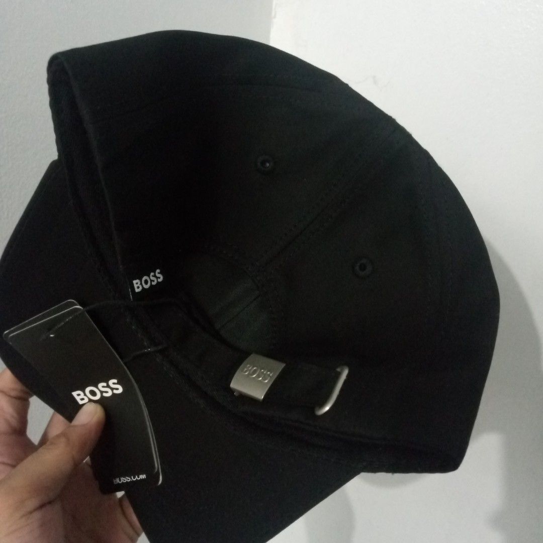 Hugo Boss Black Cap with Silver Logo (Category: Caps & Hats) located in Manila. Submitted by pablopresk0. (Listing ID 1464742429, Image 2). Description: - Brand: Hugo Boss - Color: Classic Black with Silver Metallic Lettering - Condition: Brand new with original tags attached - Features: Adjustable strap with embossed metal buckle - Details: Branded interior taping and official wash care label inside Manila location📍 Excellent condition✅ Pm if i