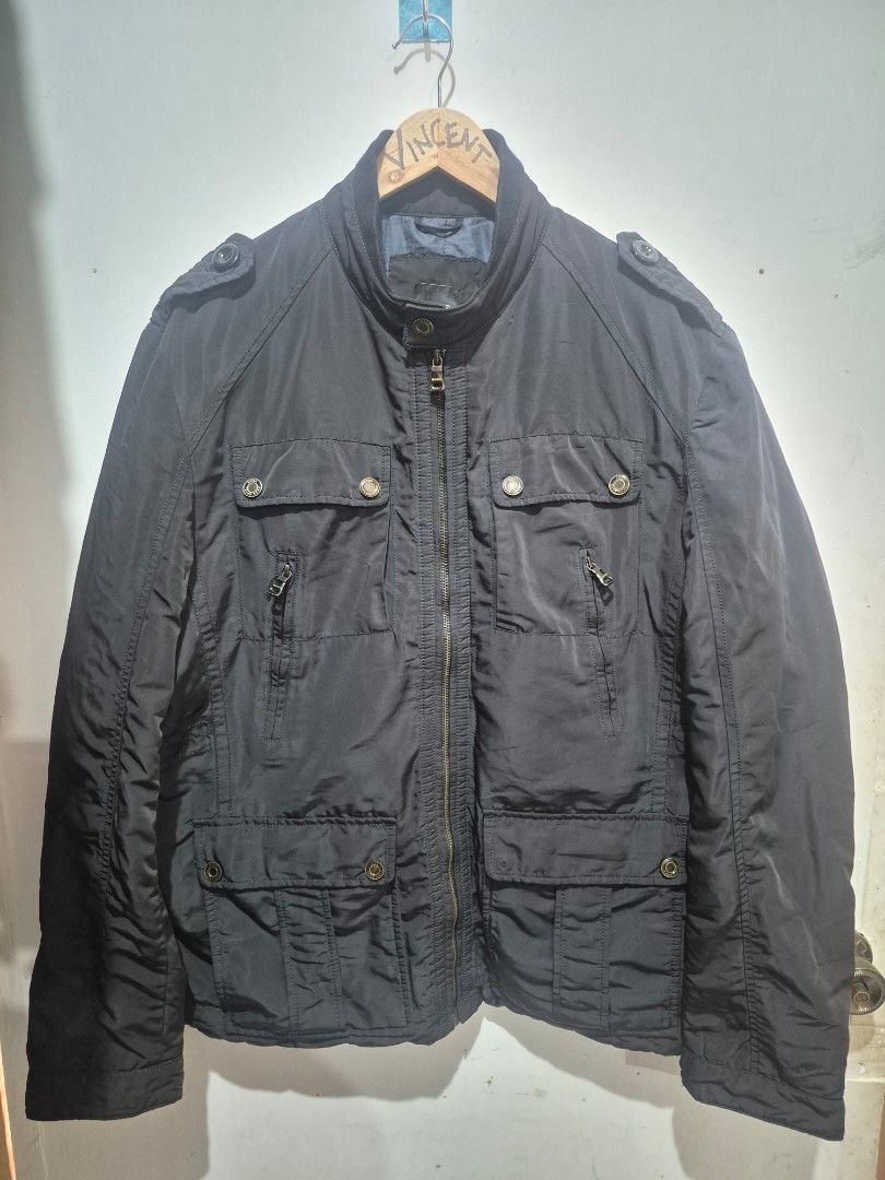 Hugo Boss Black Winter Jacket Outerwear (Category: Coats, Jackets and Outerwear) located in Bulacan. Submitted by vince4593 (Listing ID 1464712829, Image 1). Description: - Authentic Hugo Boss black winter jacket - Heavyweight and very warm construction - Full front zipper with branded metal hardware and snap buttons - Multiple front utility pockets with flap closures and zippers - Stylish high collar design - Padded quilted dark blue interior li