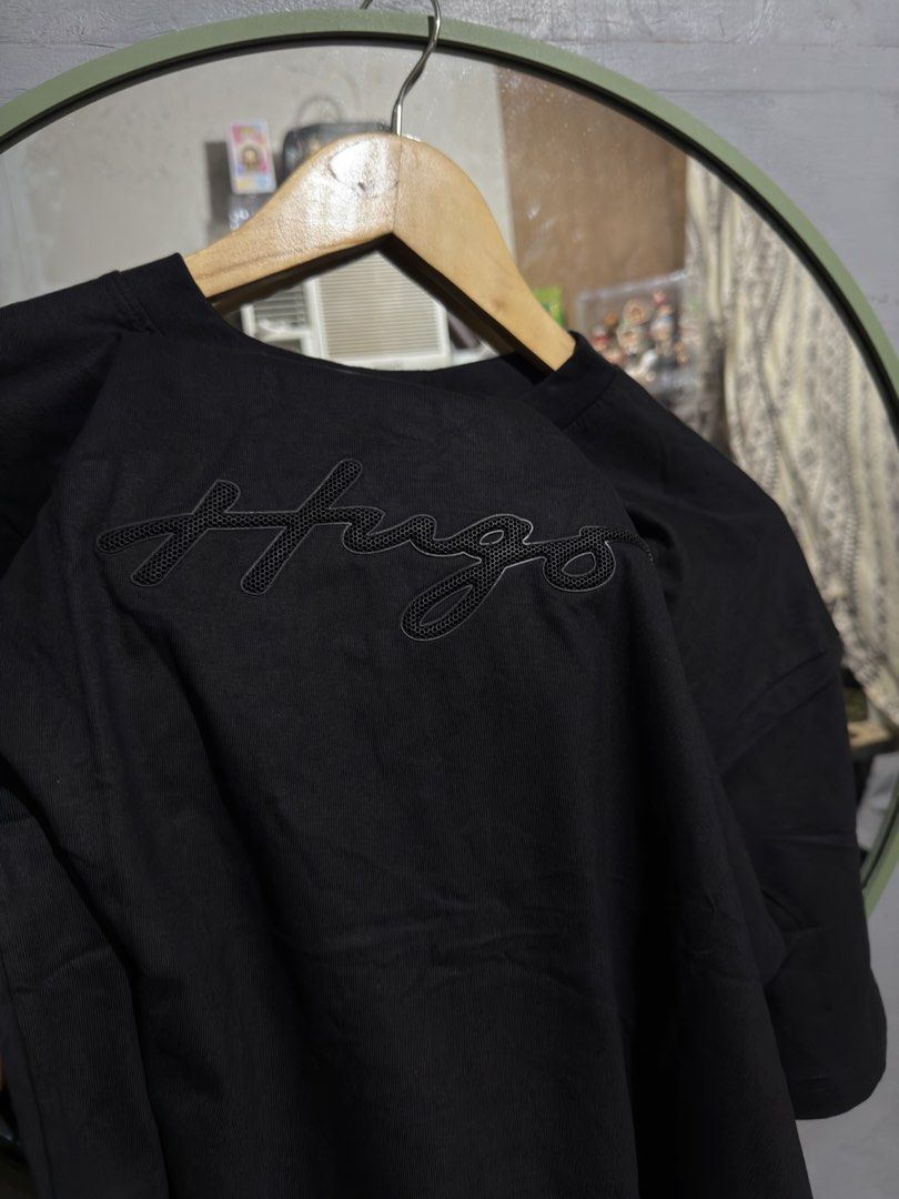 HUGO BOSS Shirt (Category: Tshirts & Polo Shirts ) located in Manila. Submitted by tindero-ng-damit (Listing ID 1464701667, Image 2). Description: Hugo Boss - Rubber Embossed Logo Size M on tag - 22 x 28 - Fit Large No issue - Flawless .