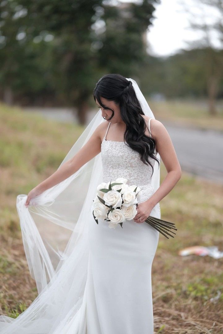 IFAV Wedding Gown (Category: Flowers & Bouquets) located in Imus. Submitted by heypeya (Listing ID 1464636059, Image 2). Description: Custom made by IFAV Designs Original Price: 45000 ​Size: Fits up to 28-inch waist ​Fabric: Crepe Fabric ​Features: Zipper back with a hidden inner corset for a flattering, structured fit. ​Inclusions: ​1 Plain Cathedral Veil ​1 Pearl-Embellished Cathedral Veil ​1 Long-Stemmed Fabric Bouquet and Groom’s Boutonniere 