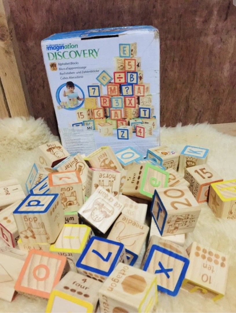 Imagination Discovery Alphabet Blocks Wooden Learning Toy (Category: Educational & Learning Toys) located in Caloocan City. Submitted by carmelasfashiongallery (Listing ID 1464660307, Image 1). Description: - Wooden alphabet and number blocks - From Imagination Discovery - Features letters, numbers, and pictures (animals, objects) - Ideal for learning and creative play - Original box included - Plenty of blocks for endless fun.