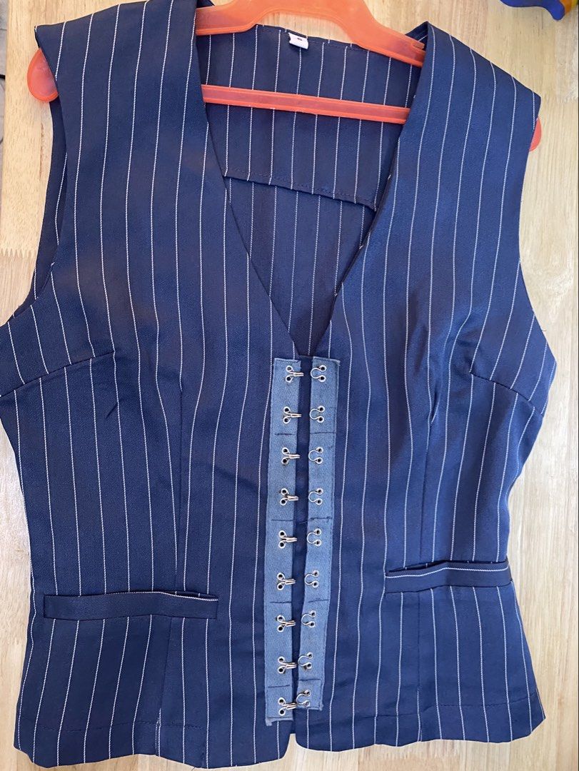 Indigo Pinstripe Vest (Category: Sleeveless) located in Cavite. Submitted by helloize (Listing ID 1464673760, Image 2). Description: - Navy blue vest with white pinstripes - V-neck design - Hook and eye closure down the front - Two faux pockets on the front - Sleeveless - Perfect for pairing with jeans or trousers Photo for reference only. Never used.