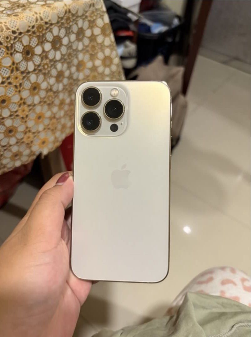 iPhone 13 pro | 128gb GOLD 🌟 (Category: iPhone 13 Series) located in Manila. Submitted by marthina246 (Listing ID 1464590758, Image 1). Description: IOS 26.6.1 - factory unlocked - NTC approved - any sim - 72% BH orig battery (makunat) - minor scratches, smooth performance, over all no issue (lady owned) - all parts are original, never been opened or repair - ALL WORKING AND NO HIDDEN ISSUES inclusions: - unit (iphone13pro gold 128gb) - original