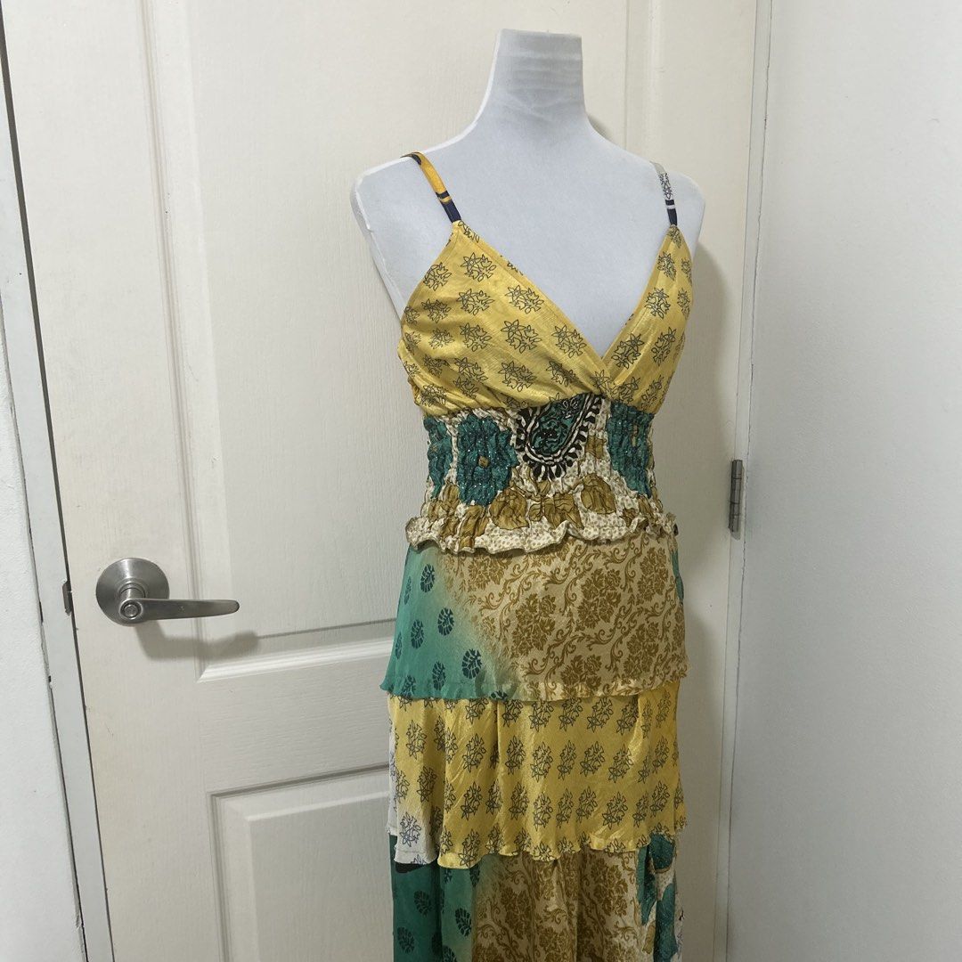 ISHKA Boho Patchwork Flowy Tiered Maxi Dress (Category: Dresses) located in Quezon City. Submitted by lilinred (Listing ID 1464685377, Image 2). Description: Really pretty mixed floral and paisley prints with subtle glittery details. Has adjustable spaghetti straps and a ruched/fitted waist. Very flowy and flattering when worn. No flaws fits xsmall to med.