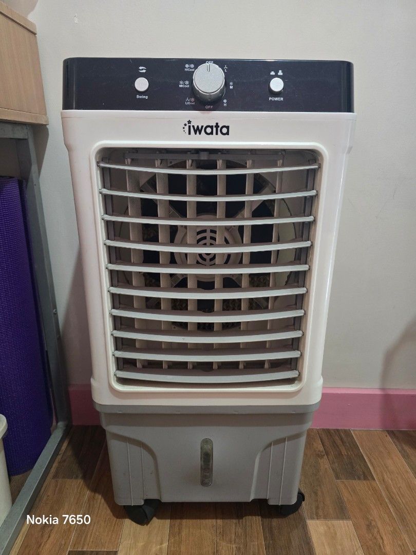 Iwata Air Cooler Z23 (Category: Air Conditioning and Heating) located in Pasig City. Submitted by varuvs (Listing ID 1464611693, Image 1). Description: Iwata Portable Evaporative Air Cooler - 3 Speed Setting - Cool Mode & Swing Function - With 2 ice packs - built-in wheels - 20 liter water tank - Newly replaced water pump - Seldom used Pick up at my place or shipping at buyer's expense.