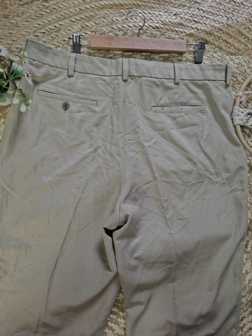 IZOD Golf Khaki Pants Size 38x32 (Category: Chinos) located in Bulacan. Submitted by cathycampo51092 (Listing ID 1464756181, Image 3). Description: IZOD golf pants in khaki beige. Tag size 38 waist, 32 length. Measured flat: 38 waistline, 11 width, 41 length. Two back pockets with button closure on one. Interior lining and pocket construction shown in photos. Classic straight leg cut for golf or casual wear..
