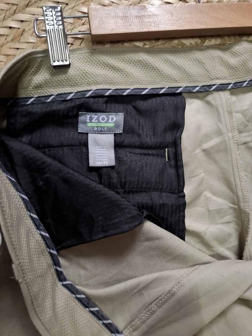 IZOD Golf Khaki Pants Size 38x32 (Category: Chinos) located in Bulacan. Submitted by cathycampo51092 (Listing ID 1464756181, Image 2). Description: IZOD golf pants in khaki beige. Tag size 38 waist, 32 length. Measured flat: 38 waistline, 11 width, 41 length. Two back pockets with button closure on one. Interior lining and pocket construction shown in photos. Classic straight leg cut for golf or casual wear..