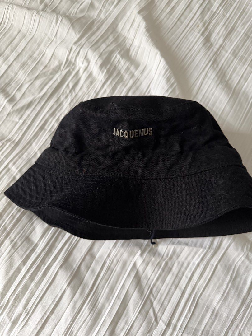 Jacquemus Bucket Hat (Category: Hats & Beanies) located in Makati City. Submitted by miarchives (Listing ID 1464637610, Image 1). Description: 🍒 jacquemus bucket hat, authentic :) pls not the stain in front 🛒 P1000, gcash/qrph only 🚛 grab / lalamove only 💵 sf shouldered by buyer.