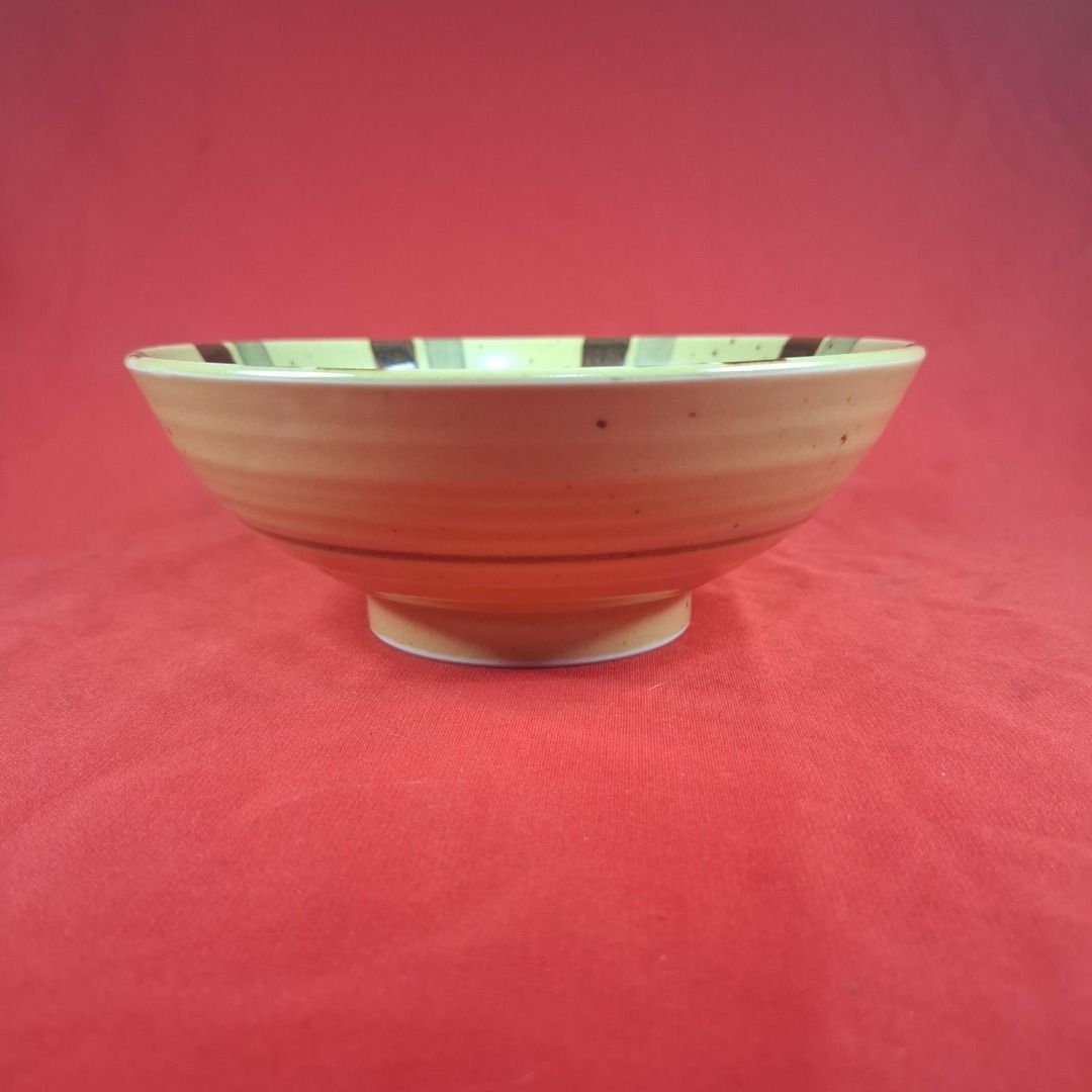 Japanese Ceramic Rice Bowl with Striped Pattern (Category: Dinnerware & Cutlery) located in Mandaluyong City. Submitted by edward123_andren (Listing ID 1464708051, Image 1). Description: - Material: Ceramic with a cream-colored base and speckled finish - Design: Japanese minimalist style featuring a striped interior with brown and green brush strokes - Features: Small raised foot on the bottom for stability - Versatile Use: Ideal for rice, soup, 