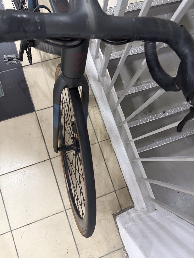 Java road bike (Category: Bicycles) located in Singapore. Submitted by qeekhan24189 (Listing ID 1464679850, Image 3). Description: - java road bike - Dark grey frame with blue accents - Equipped with disc brakes - Features drop handlebars -new tires -new brakes.