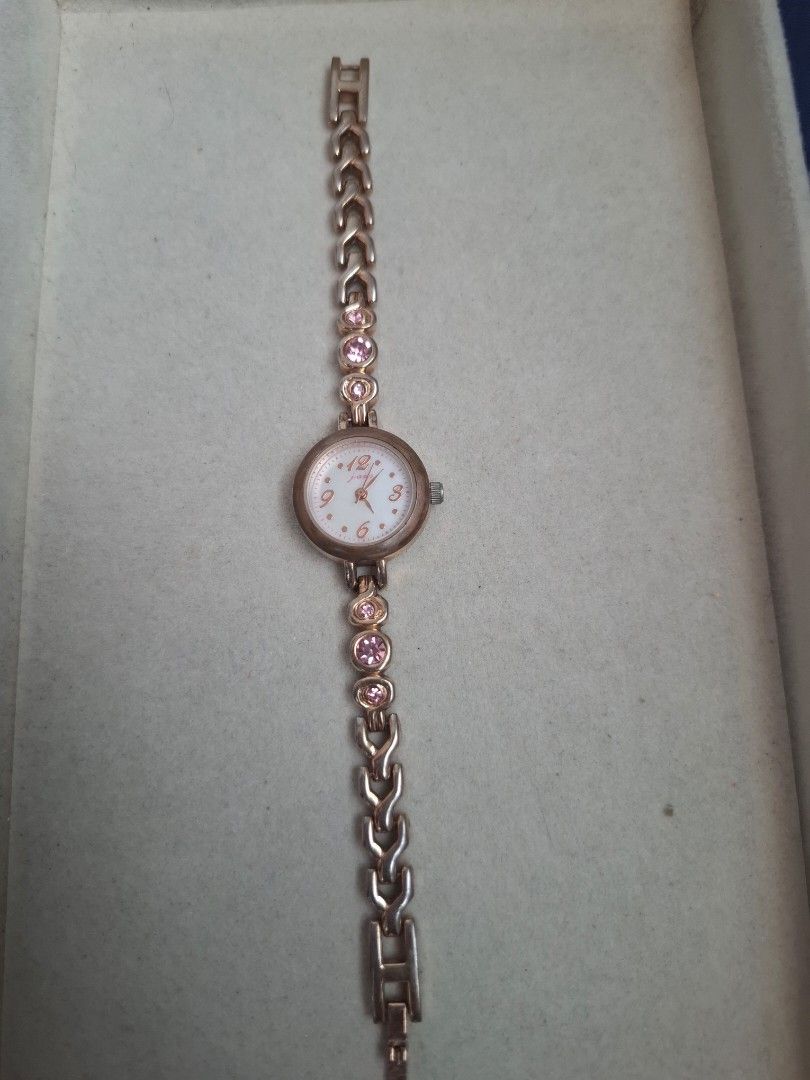 J-axis Sun Flame Watch (Category: Women's Watches) located in Abucay. Submitted by icia_marie18 (Listing ID 1464582369, Image 1). Description: J-Axis Sun Flame Watch issue: major fadings and sign of usage best fit for 6 inches wrist rose gold color japan movement.