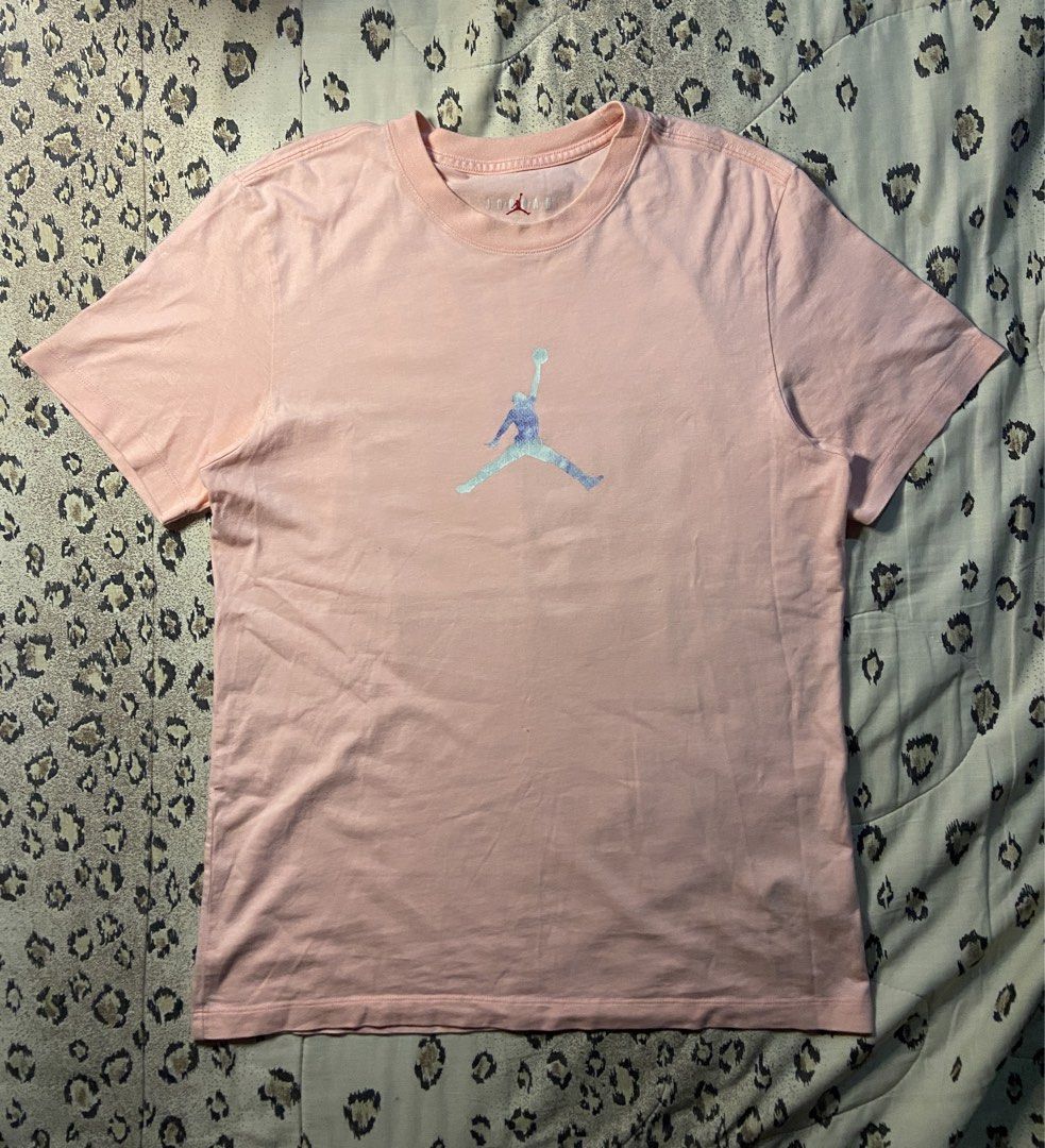 Jordan 23 Pink T-Shirt (Category: Shirts) located in Manila. Submitted by nix.thrift (Listing ID 1464670583, Image 1). Description: - Pink Jordan t-shirt - Features iconic Jumpman logo on the front - 'JORDAN 23' graphic on the back - Made in Cambodia - 100% Cotton - Size: Large (L).
