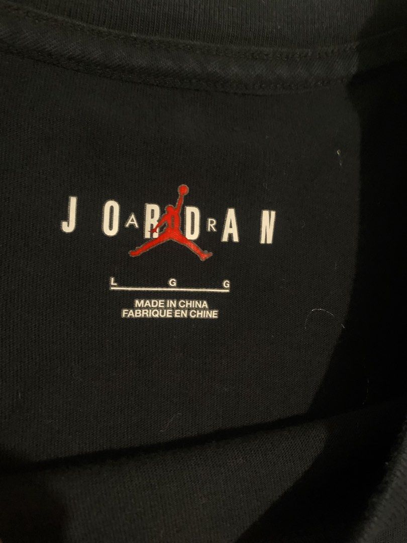 Jordan Jumpman 23 Graphic Tee Black Size L (Category: Tshirts & Polo Shirts ) located in Cebu City. Submitted by tangubrhia45277 (Listing ID 1464701127, Image 3). Description: - Brand: Jordan - Color: Black with pinkish-orange logo - Size: Large - Material: 100% Cotton - Fit: Standard short sleeve crewneck - Design: Large Jumpman logo on front chest, large '23' and Jordan text on the upper back - Authenticity: Style code DO8899-010 on inner tag.