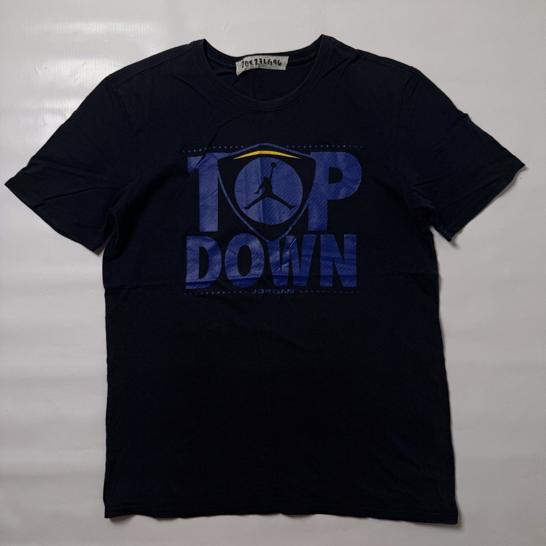 Jordan Top Down T-Shirt Black Size L (Category: Tshirts & Polo Shirts ) located in Manila. Submitted by johnedel_james (Listing ID 1464696776, Image 1). Description: - Authentic Jordan graphic t-shirt (Style code: 717883-010) - Color: Dark Navy / Black - Size: Large (Regular fit) - Material: 100% Cotton, Made in China - Design: Large 'TOP DOWN' front print with iconic Jumpman logo inside shield graphic - Condition: Crew neck, short sleeves, casua