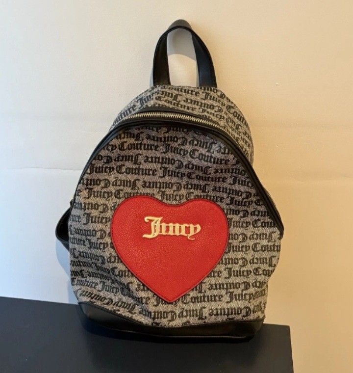 Juicy Couture OG Monogram Backpack (Category: Backpacks) located in Navotas City. Submitted by ms.soulana (Listing ID 1464251199, Image 1). Description: PreOwned Lightly Used Authentic Iconic Juicy Couture monogram print backpack - Adorable red heart detail with Juicy Couture logo on the front - Chic black faux leather trim and adjustable straps - Interior lining features the signature Juicy Couture print - Secure zipper closure - Ideal for every