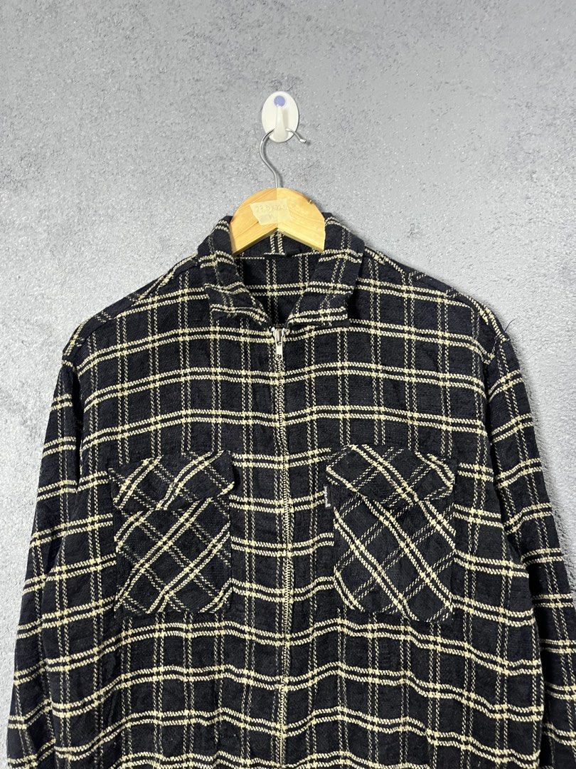 Jungle Storm Plaid Zip Shirt Jacket (Category: Coats, Jackets and Outerwear) located in Famy. Submitted by basicthrifted (Listing ID 1464702435, Image 2). Description: - Brand/Model: Jungle Storm - Size: Medium - Pattern: Black and cream plaid with diagonal chest pocket detailing - Closure & Collar: Full zip front with fold-down collar - Pockets: Two buttoned chest pockets - Sleeves: Long sleeves with button cuffs - Condition/Style: Good everyday
