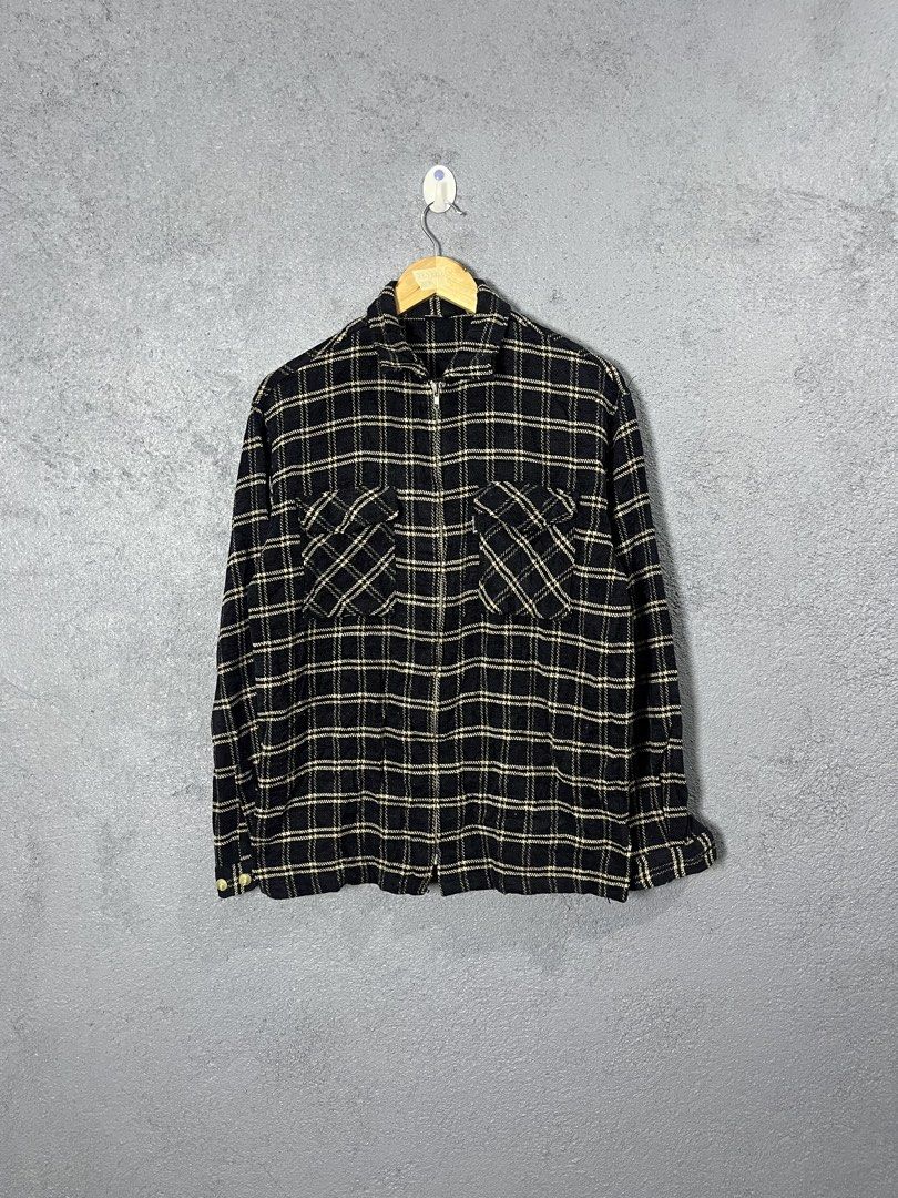 Jungle Storm Plaid Zip Shirt Jacket (Category: Coats, Jackets and Outerwear) located in Famy. Submitted by basicthrifted (Listing ID 1464702435, Image 1). Description: - Brand/Model: Jungle Storm - Size: Medium - Pattern: Black and cream plaid with diagonal chest pocket detailing - Closure & Collar: Full zip front with fold-down collar - Pockets: Two buttoned chest pockets - Sleeves: Long sleeves with button cuffs - Condition/Style: Good everyday