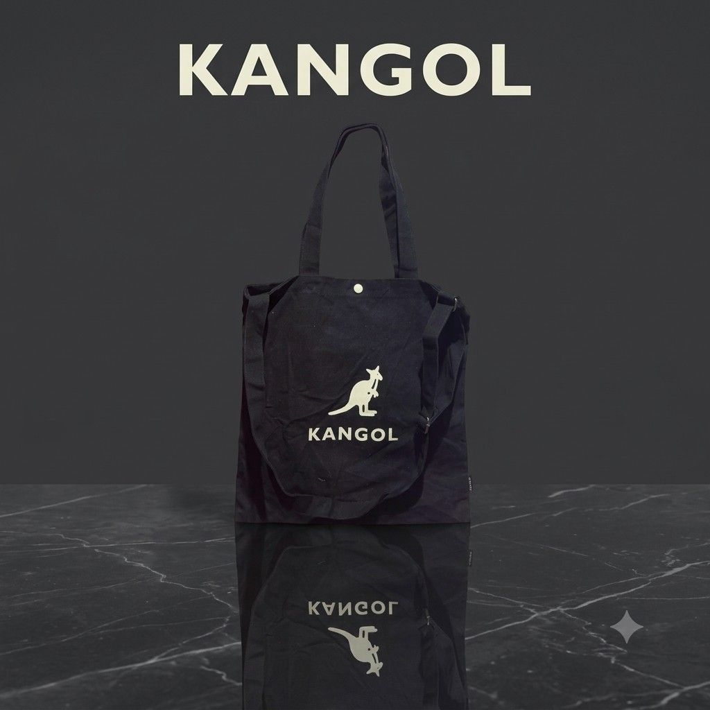 Kangol Black Canvas Tote Bag (Category: Tote Bags) located in Carmen. Submitted by ar_thrift00 (Listing ID 1464715206, Image 1). Description: - Brand: Kangol - Color: Classic Black with large white kangaroo logo - Material: 100% Cotton Canvas - Closure: Secure snap button - Storage: Roomy main compartment with inner pocket - Versatility: Includes top carry handles and an adjustable shoulder strap - Model: KOEB-EB00370 - Condition: Excellent every