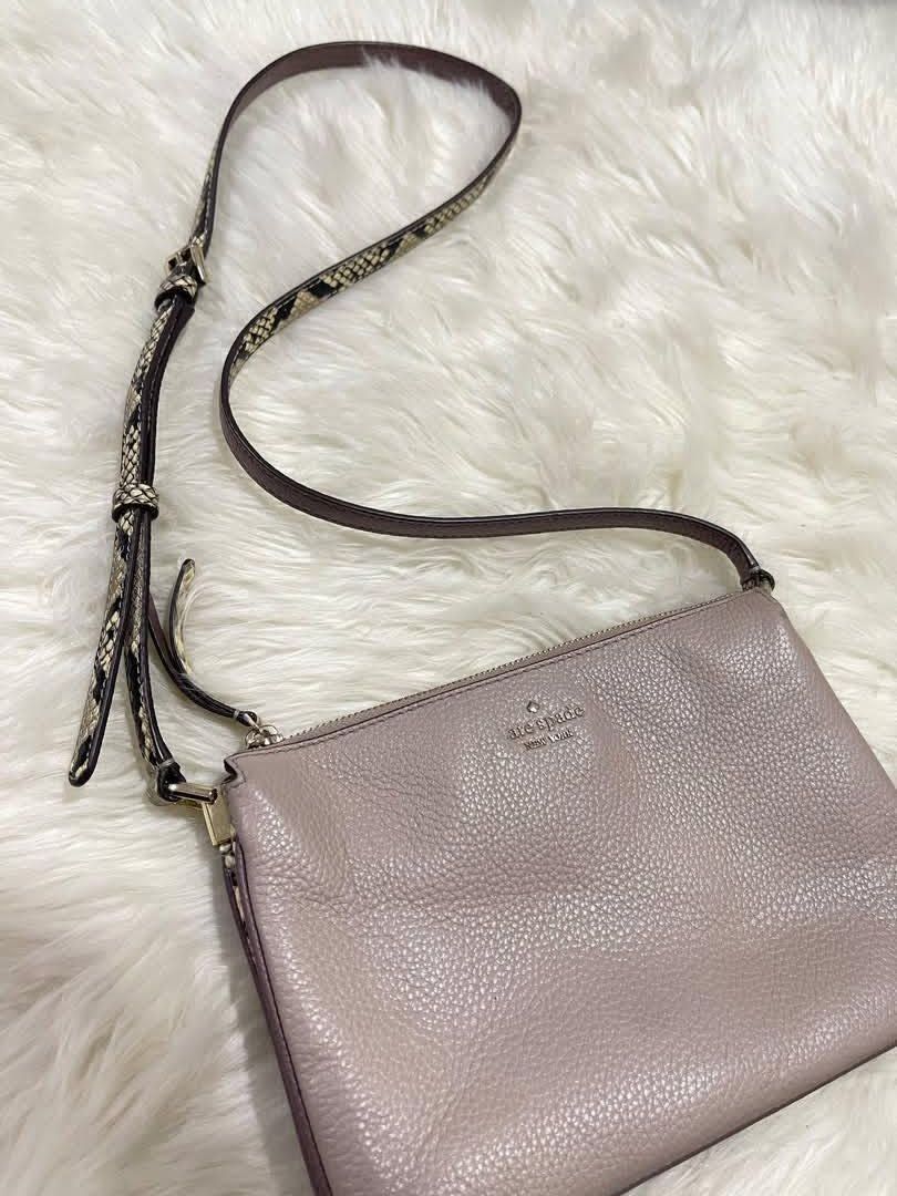 Kate Spade Gray (100% orig & Pre-loved) (Category: Cross-body Bags) located in Quezon City. Submitted by declutterbybd (Listing ID 1464684133, Image 1). Description: Authentic 💯 — Kate Spade Crossbody bag (Gray) *100% Authenticity Guaranteed! *Bag purchased directly from US *Design: Gray Crossbody bag. The strap has a snake print design. Many pockets inside. *Status: Used Bag but the bag still in good condition *Issue: The Embossed “K” in the fr