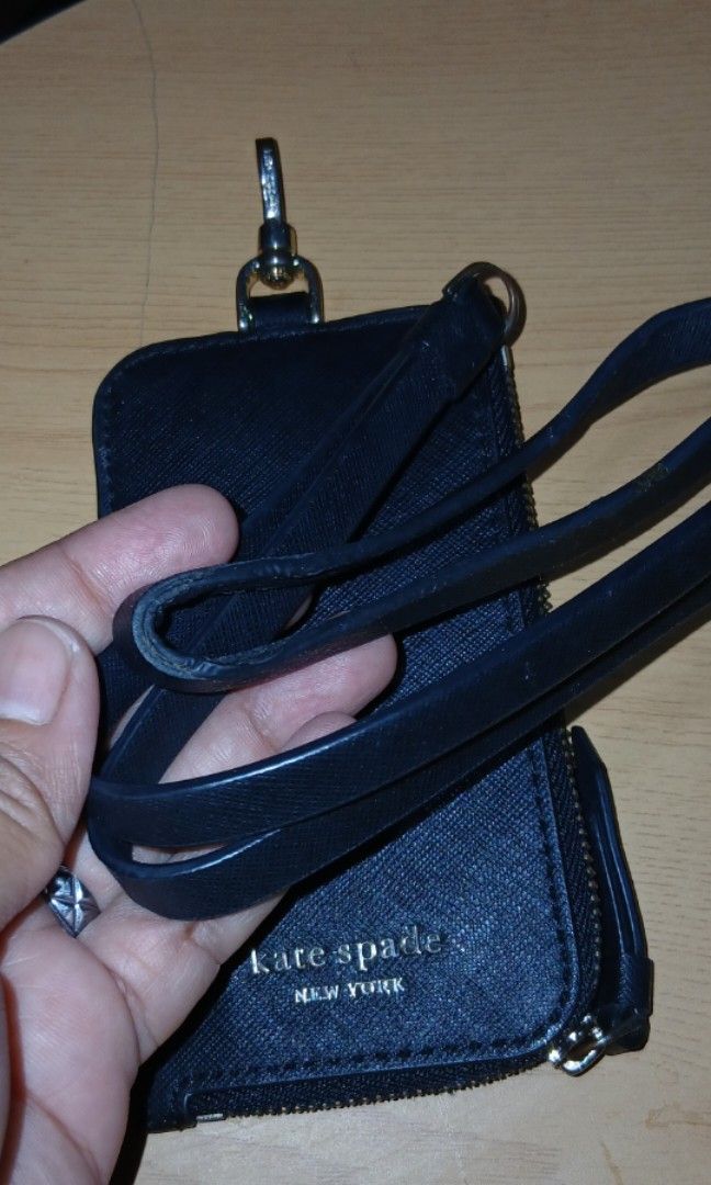 Kate Spade Lanyard (Category: Wallets & Card holders) located in Manila. Submitted by shoppebymaria (Listing ID 1464575732, Image 3). Description: Kate Spade Lanyard May flaw sa.rubber lining sa dulong stral and yung hardware faded. Pero okay pa naman yun holder. Item is in Pangasinan. Shipping via J&T.