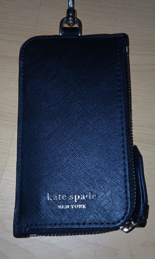 Kate Spade Lanyard (Category: Wallets & Card holders) located in Manila. Submitted by shoppebymaria (Listing ID 1464575732, Image 1). Description: Kate Spade Lanyard May flaw sa.rubber lining sa dulong stral and yung hardware faded. Pero okay pa naman yun holder. Item is in Pangasinan. Shipping via J&T.