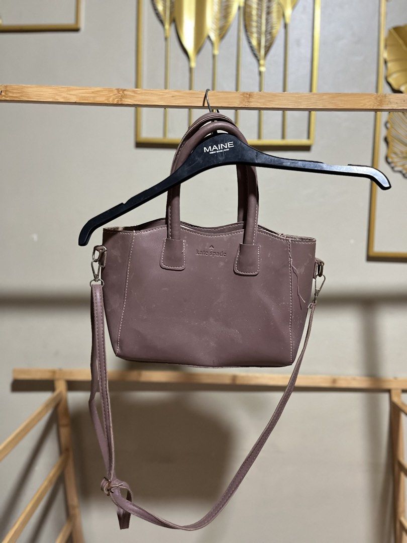 Kate Spade Mauve Leather Top Handle Bag with Strap (Category: Luxury Bags & Wallets) located in Caloocan City. Submitted by decluttering.101_ (Listing ID 1464622158, Image 1). Description: - Kate Spade handbag - Beautiful mauve/dusty rose color - Genuine leather material - Versatile: top handles and detachable crossbody strap - Secure zipper closure - Interior lined in light pink - Minor exterior marks, please check photos for details - Ideal siz