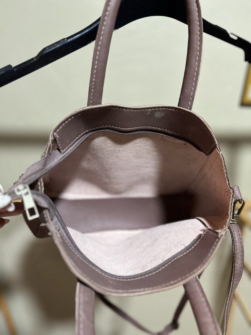 Kate Spade Mauve Leather Top Handle Bag with Strap (Category: Luxury Bags & Wallets) located in Caloocan City. Submitted by decluttering.101_ (Listing ID 1464622158, Image 2). Description: - Kate Spade handbag - Beautiful mauve/dusty rose color - Genuine leather material - Versatile: top handles and detachable crossbody strap - Secure zipper closure - Interior lined in light pink - Minor exterior marks, please check photos for details - Ideal siz