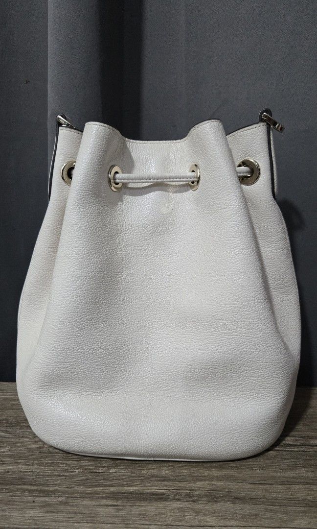 Kate Spade White Leather Bucket Bag with Strap (Category: Cross-body Bags) located in San Juan City. Submitted by misiskrafftie (Listing ID 1464653639, Image 2). Description: - Brand: Kate Spade New York - Color: White - Material: Pebbled Leather - Closure: Drawstring - Strap: Shoulder strap - Hardware: Gold - Style: Clean, classic bucket bag - Ideal for: Everyday use.