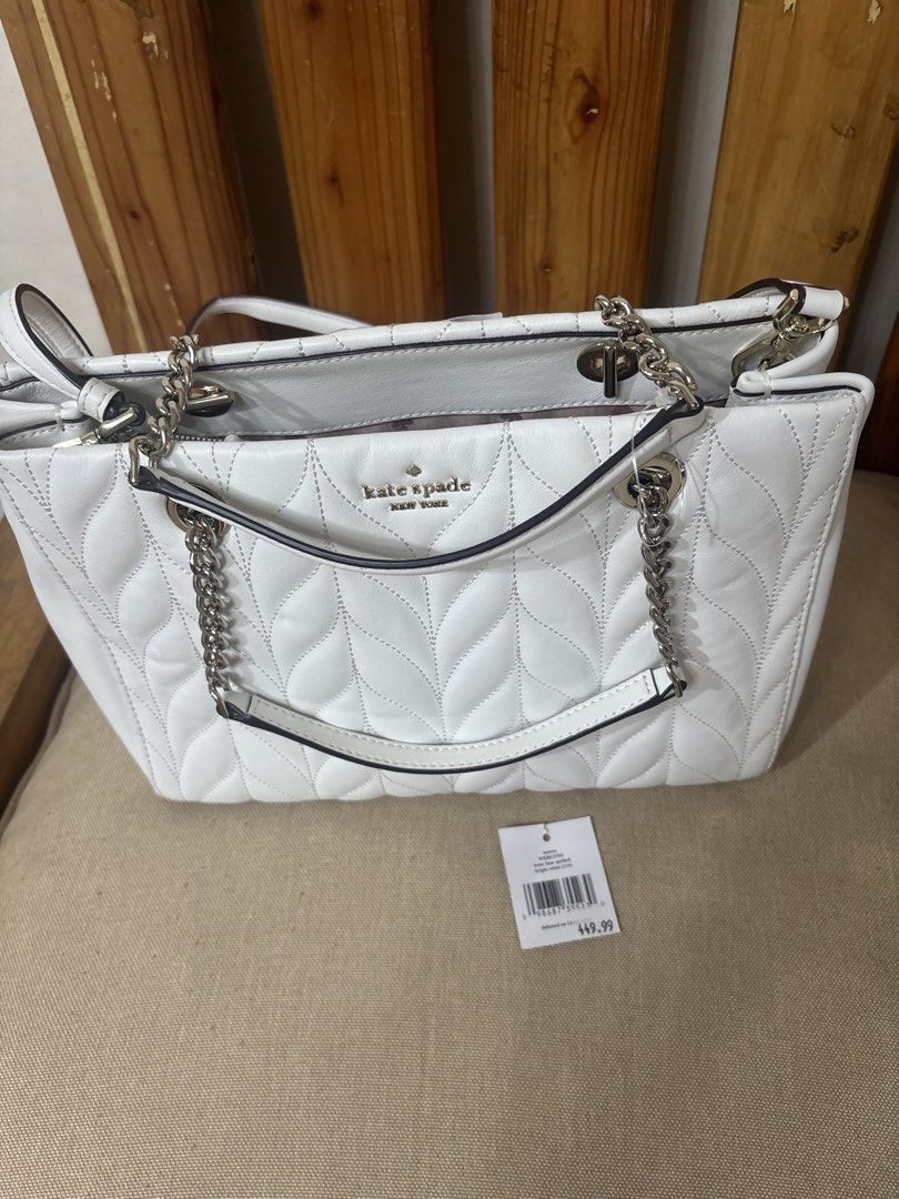 Kate Spade White Quilted Leather Shoulder Bag (Category: Shoulder Bags) located in Famy. Submitted by frenchmacaroon (Listing ID 1464594306, Image 2). Description: - White quilted leather shoulder bag by Kate Spade - Features elegant silver chain details - Interior zip pockets for organization - Comes with original tags attached - Versatile for everyday wear or special events Tag removed but brandnew.