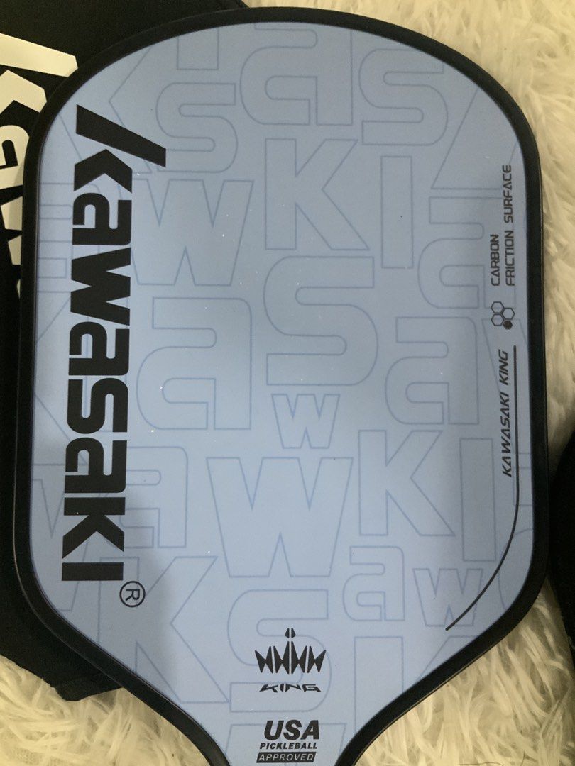Kawasaki Pickleball Paddle Bundle (Category: Racket and Ball Sports) located in Manila. Submitted by beyondthespotlight (Listing ID 1464707226, Image 2). Description: Set of 2 Kawasaki pickleball paddles Paddle 1 (Blue and Green) : Carbon Fiber T300 w/ fiberglass Paddle 2 (Blue King) : Carbon Fiber, signs of usage on paddle - Both paddles feature carbon fiber construction for excellent playability - Includes 2 official kawasaki covers - Officiall