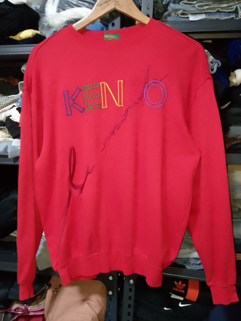 KENZO GOLF Red Embroidered Logo Sweatshirt (Category: Coats, Jackets and Outerwear) located in Manila. Submitted by mjthrifted_second (Listing ID 1464639192, Image 1). Description: - Red Kenzo Golf Sweatshirt -Dimes: 22/26 - Classic crewneck style - Colorful embroidered Kenzo Golf logo on the front - Ideal for Kenzo enthusiasts.