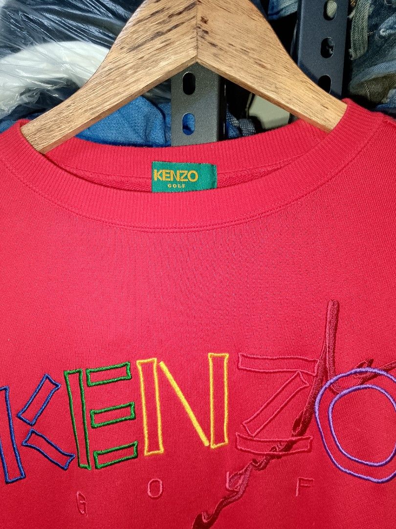 KENZO GOLF Red Embroidered Logo Sweatshirt (Category: Coats, Jackets and Outerwear) located in Manila. Submitted by mjthrifted_second (Listing ID 1464639192, Image 2). Description: - Red Kenzo Golf Sweatshirt -Dimes: 22/26 - Classic crewneck style - Colorful embroidered Kenzo Golf logo on the front - Ideal for Kenzo enthusiasts.