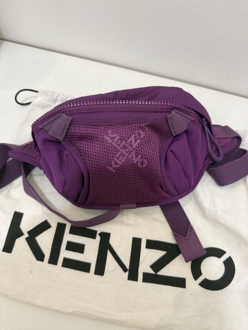 Kenzo Purple Logo Beltbag (Category: Purses & Pouches) located in Angeles City. Submitted by bagpriceinfiniteluck (Listing ID 1464734145, Image 1). Description: Stands out with its textured mesh front pocket and a diagonal logo branding Fits big phones : iphone promax, adjustable sling. READY FOR SHIPPING🇵🇭🇵🇭 Thank you. God Speed.