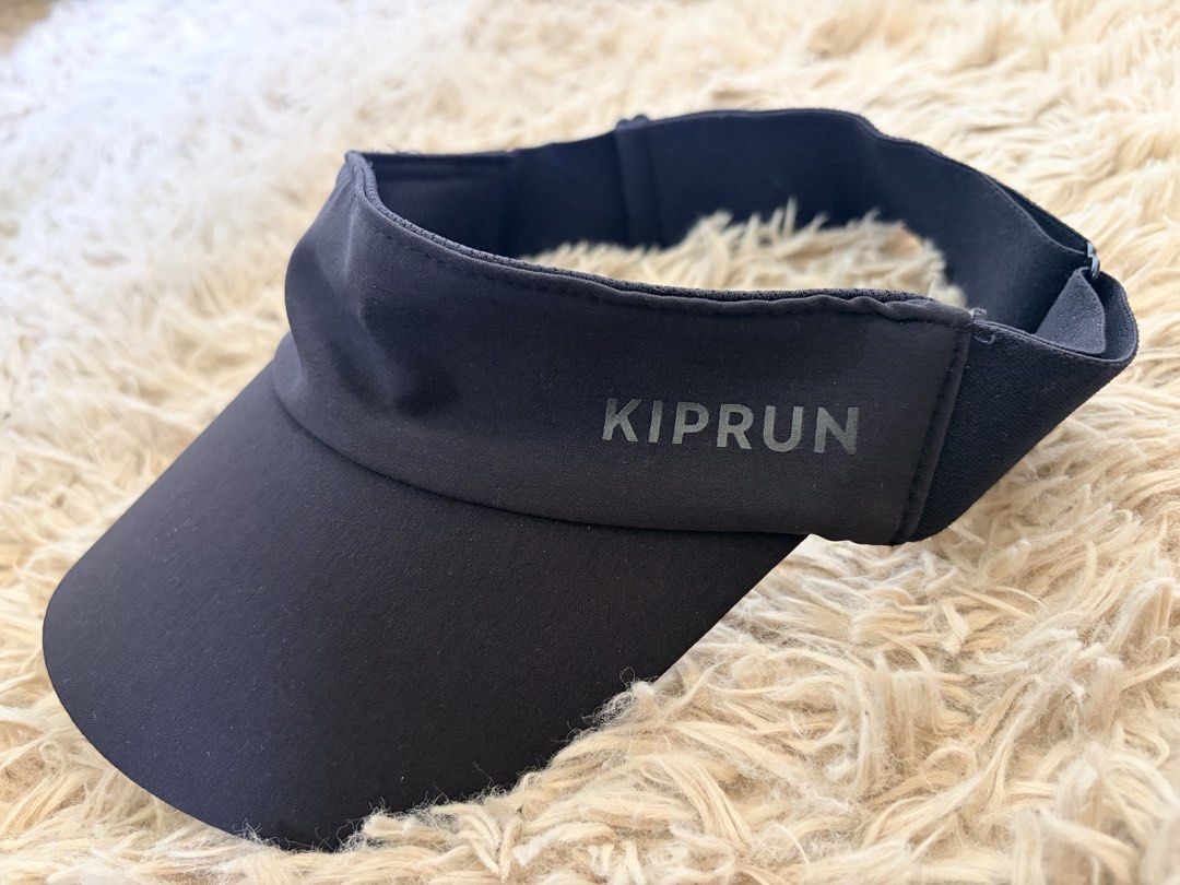 Kiprun Running Visor Black (Category: Caps & Hats) located in Mandaluyong City. Submitted by maximuuus (Listing ID 1464699069, Image 1). Description: - Color: Black - Brand: Kiprun - Lightweight and quick-drying material - Curved brim for reliable sun protection - Adjustable back strap for a secure fit - Minimalist design with subtle grey side branding - Easy to wash and maintain.