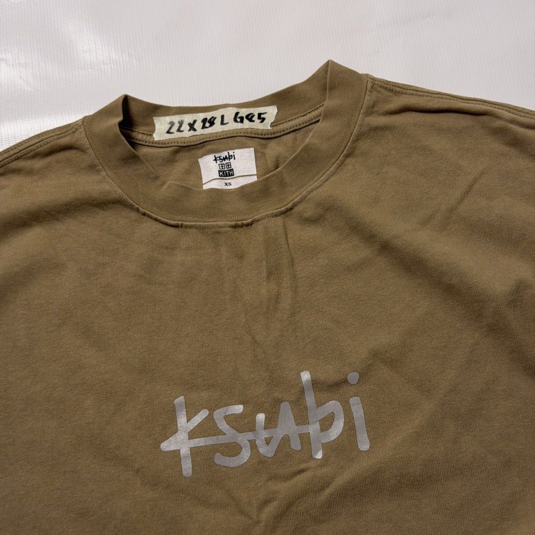Kith x Ksubi Brown T-Shirt (Category: Tshirts & Polo Shirts ) located in Manila. Submitted by johnedel_james (Listing ID 1464709511, Image 2). Description: - Brand: Kith x Ksubi Collaboration - Color: Khaki Brown - Size: XS - Material: 100% Cotton - Design: Center Ksubi chest logo graphic - Details: Original collaboration neck label intact - Care: Hand wash recommended.