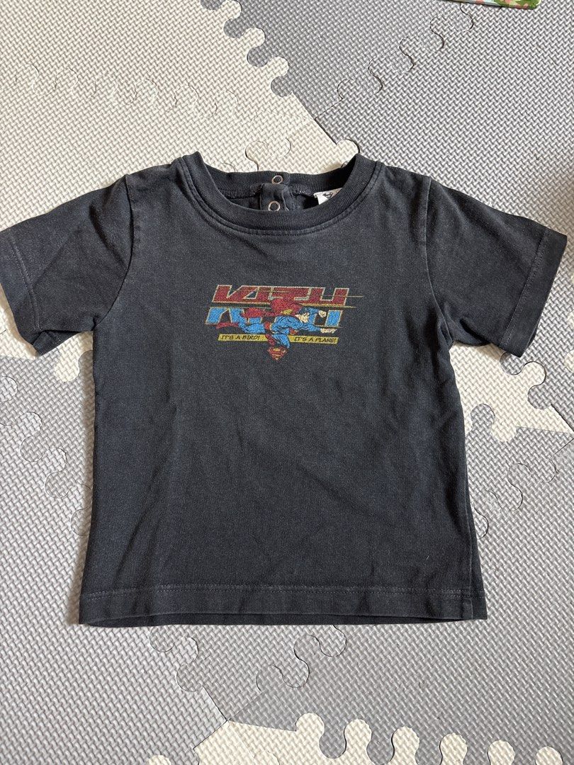 Kith x Superman Graphic Tee 12-18M (Category: Babies & Kids Fashion) located in Makati City. Submitted by shoplecloset (Listing ID 1464588100, Image 1). Description: - Cool Kith x Superman graphic tee - Dark grey color - Short sleeves with snap buttons at the back - Made in Peru - 100% Cotton - Perfect for everyday wear.