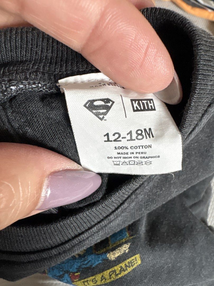 Kith x Superman Graphic Tee 12-18M (Category: Babies & Kids Fashion) located in Makati City. Submitted by shoplecloset (Listing ID 1464588100, Image 3). Description: - Cool Kith x Superman graphic tee - Dark grey color - Short sleeves with snap buttons at the back - Made in Peru - 100% Cotton - Perfect for everyday wear.