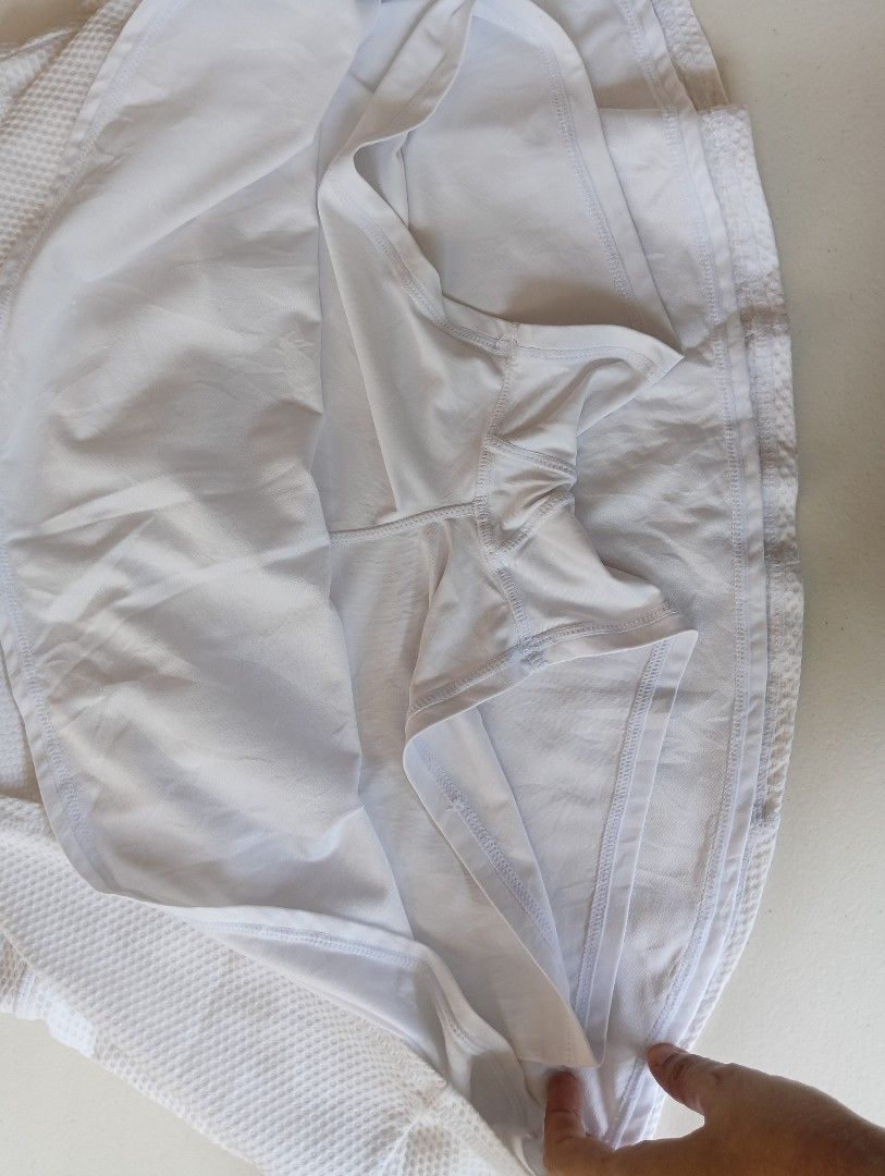 Kyodan Tennis Skirts (Category: Activewear) located in Rizal. Submitted by timeless_shop (Listing ID 1464604702, Image 3). Description: 🔥 ORIGINAL Kyodan Tennis Skirt - White Mesh Pleated - Size MEDIUM ✨ 📏 Length: 14 inches - mini pleated, ang cute! 📏 Width Waistline 16 inches Size Fit : 32-33 High Waist, garterized! 👗 Size: MEDIUM Tag 🎨 Color: White - puting-puti, malinis tingnan! ✂️ Style: Pleated Tennis Skirt with inner shorts 💯 Conditio