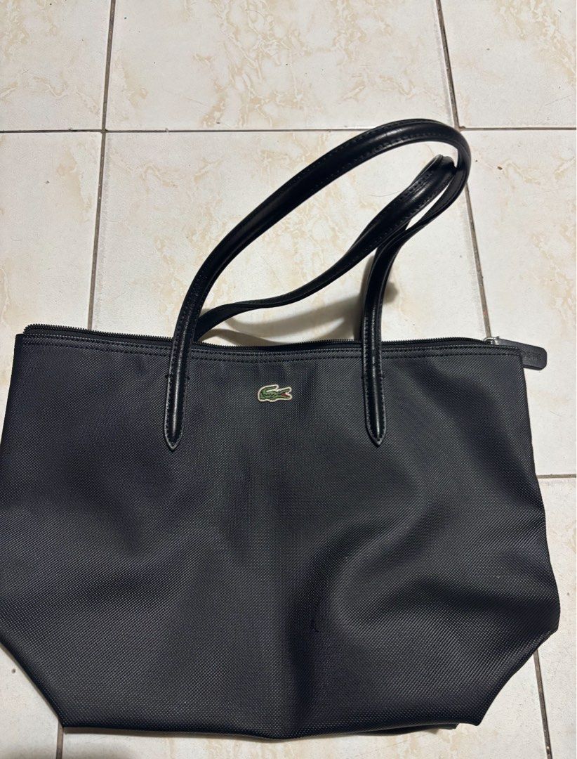 Lacoste Black Mini Tote Bag (Category: Tote Bags) located in Caloocan City. Submitted by dyosalyn (Listing ID 1464680800, Image 1). Description: - Classic black Lacoste tote bag - Secure zipper closure - Comfortable leather handles - Simple and versatile design - Ideal for everyday use or travel - Spacious interior.