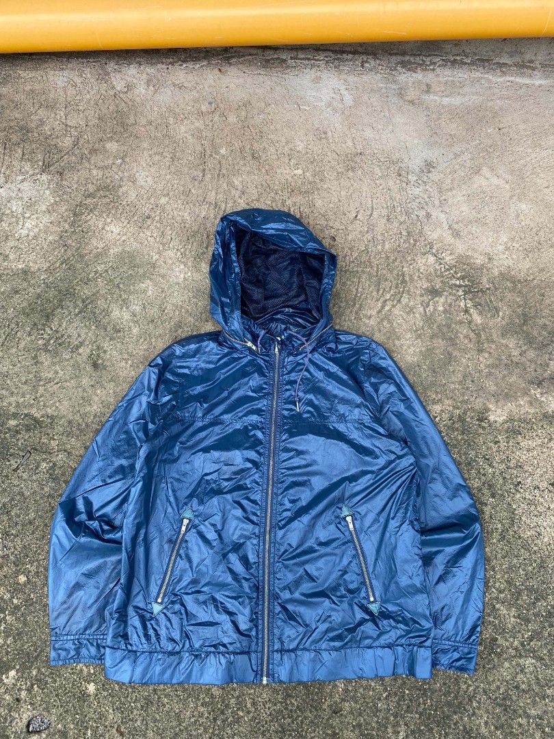 Lacoste Blue Windbreaker Hooded Jacket Size 38 (Category: Coats, Jackets and Outerwear) located in Tangub. Submitted by brightfire_c293e4 (Listing ID 1464741009, Image 1). Description: - Brand: Lacoste - Item: Hooded windbreaker - Color: Blue - Size: Tag size 38 - Material: Lightweight with dark mesh inner lining - Closure: Full zip front with branded metal pullers - Hood: Adjustable drawstring with cord locks - Pockets: Two front zippered pocket