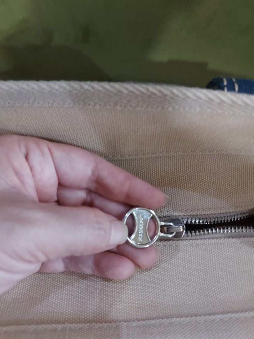 Lacoste Canvass Tote Bag (Category: Tote Bags) located in Paranaque City. Submitted by angelistar (Listing ID 1464606987, Image 2). Description: Lacoste canvass tote bag in cream and navy colors with shouldet straps and croc patch and zip logo.