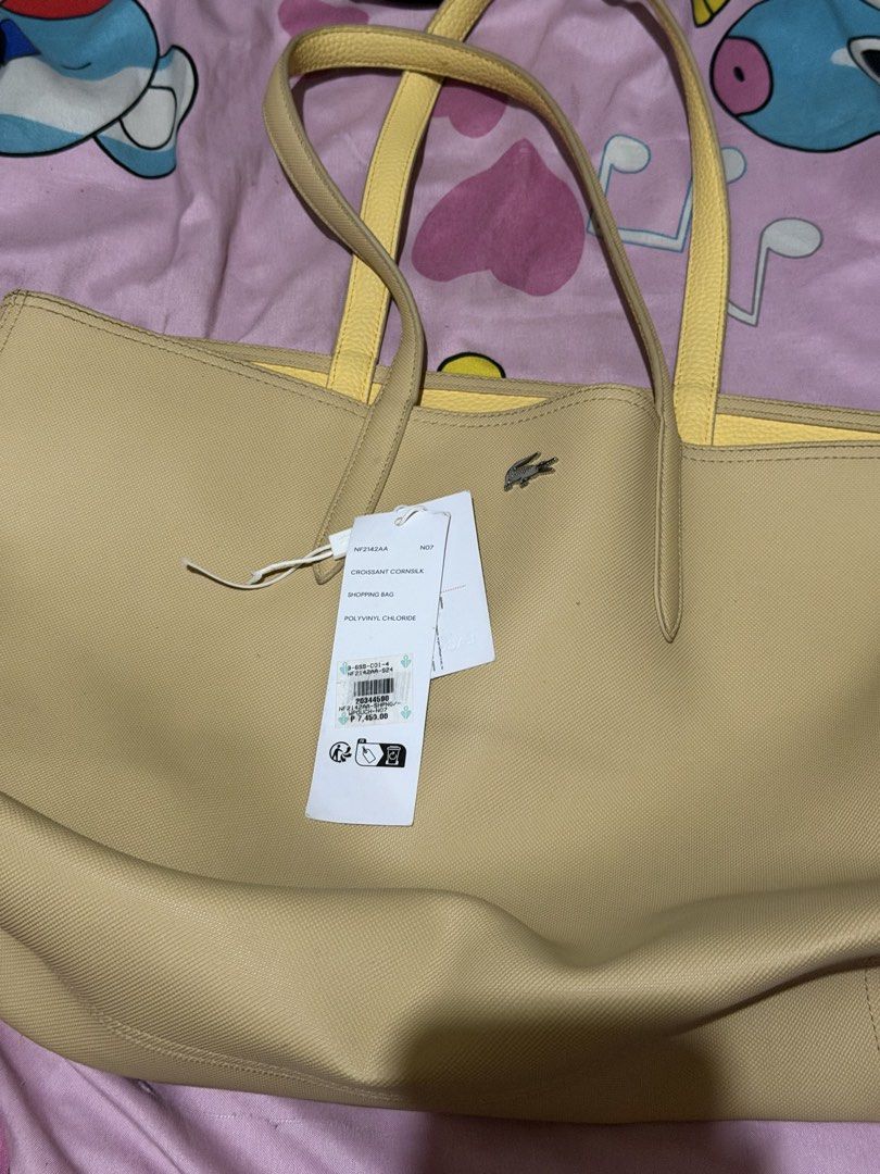 Lacoste Croissant Cornsilk Shopping Bag (Category: Tote Bags) located in Manila. Submitted by medv27 (Listing ID 1464601763, Image 1). Description: - Authentic Lacoste tote bag - Color: Light beige / Corn silk - Material: Polyvinyl Chloride (PVC) - Includes a detachable inner pouch - Ideal for shopping and everyday use - Original tags still attached.