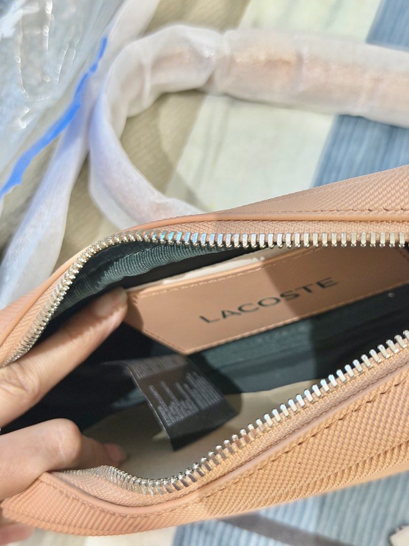 Lacoste Daily City Messenger Bag (Category: Cross-body Bags) located in Rizal. Submitted by caintarizal2024 (Listing ID 1464677712, Image 3). Description: Lacoste Sling Bag Naging display lang sa cabinet hindi pa nagagamit. Pwede ko isama ang paper bag ng Lacoste Last Price posted.