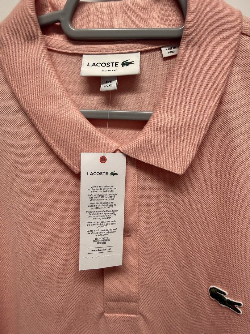 Lacoste polo Shirt (Category: Tshirts & Polo Shirts ) located in Quezon City. Submitted by mine4now (Listing ID 1464619382, Image 3). Description: What : Lacoste Polo shirt Color: Light salmon Pink Size : Xl slim fit Origin: Macy’s US Condition: Tried on then kept. Hardly noticeable tiny stain spots are due to storage. Can be washed I believe—hence, selling low. RFS: DECLUTTERING Shipping fee: PAID by the buyer No: COD Courier: lbc, grab or lalam