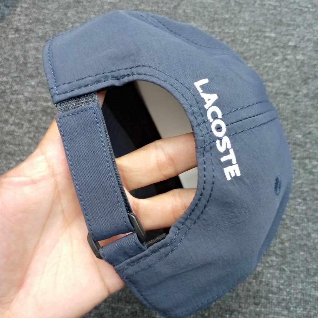 Lacoste Sport Cap Navy Blue One Size (Category: Caps & Hats) located in Manila. Submitted by pablopresk0. (Listing ID 1464668573, Image 2). Description: - Navy blue Lacoste Sport cap - Features iconic crocodile logo on the side - 'LACOSTE' text on front and back - Adjustable strap for a comfortable fit - One size fits most back Manila location📍 Excellent condition✅ Pm if interested📩 .
