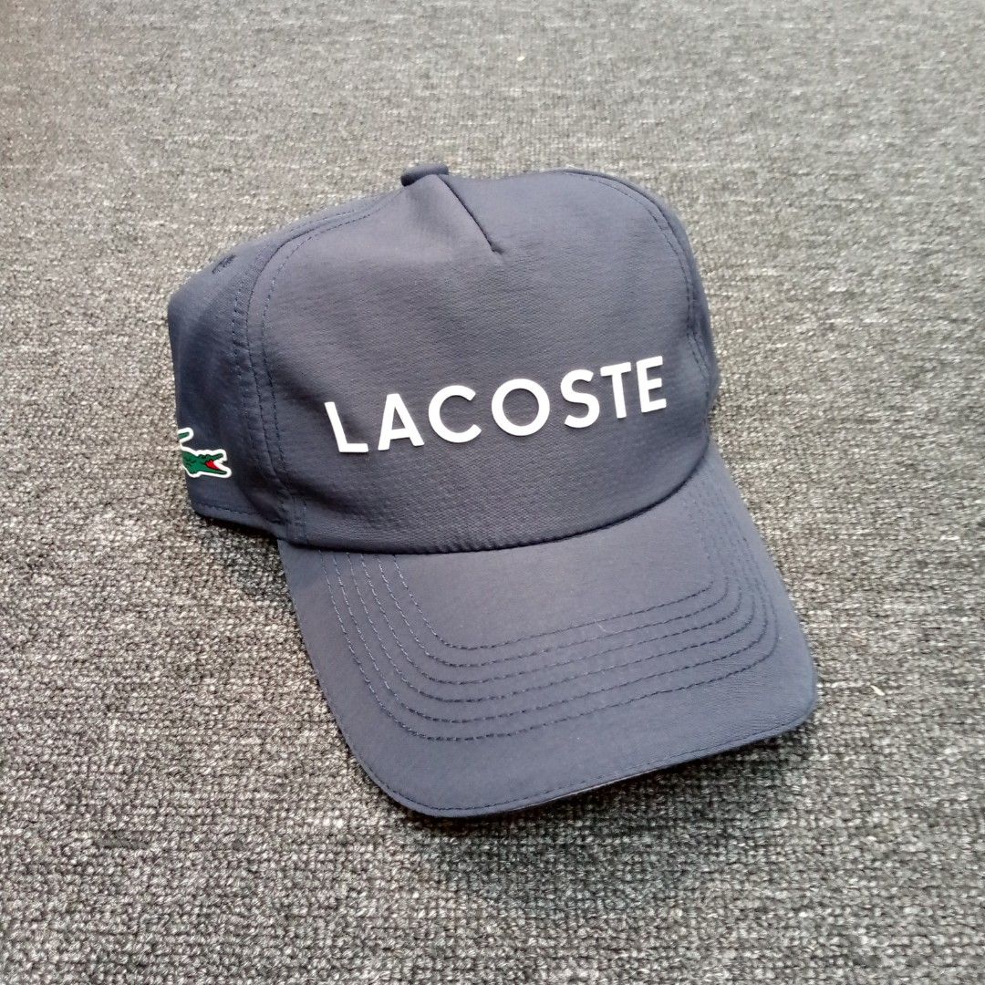 Lacoste Sport Cap Navy Blue One Size (Category: Caps & Hats) located in Manila. Submitted by pablopresk0. (Listing ID 1464668573, Image 1). Description: - Navy blue Lacoste Sport cap - Features iconic crocodile logo on the side - 'LACOSTE' text on front and back - Adjustable strap for a comfortable fit - One size fits most back Manila location📍 Excellent condition✅ Pm if interested📩 .