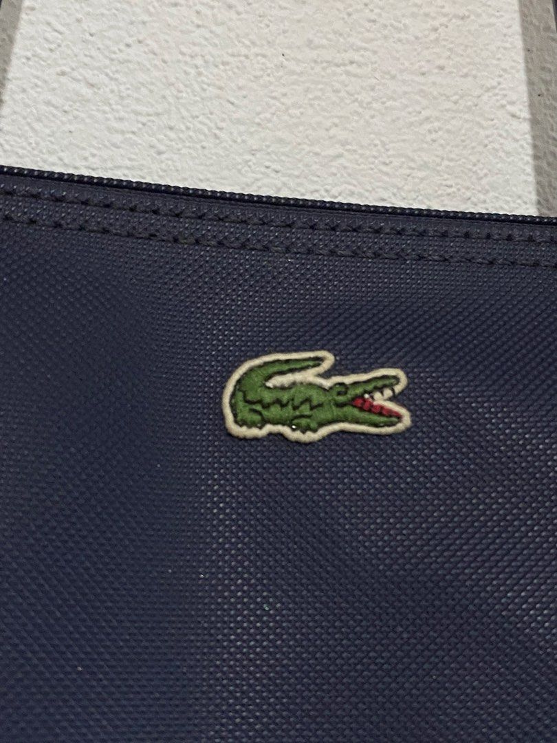 Lacoste Tote Bag (Category: Tote Bags) located in Goa. Submitted by dandd_thrift_goods (Listing ID 1464659455, Image 3). Description: ▪️Issue: May kaunting tangal na leather sa strap (Not visible) plus need wash.